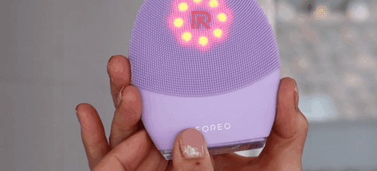 Foreo Luna 4 device next to skincare essentials